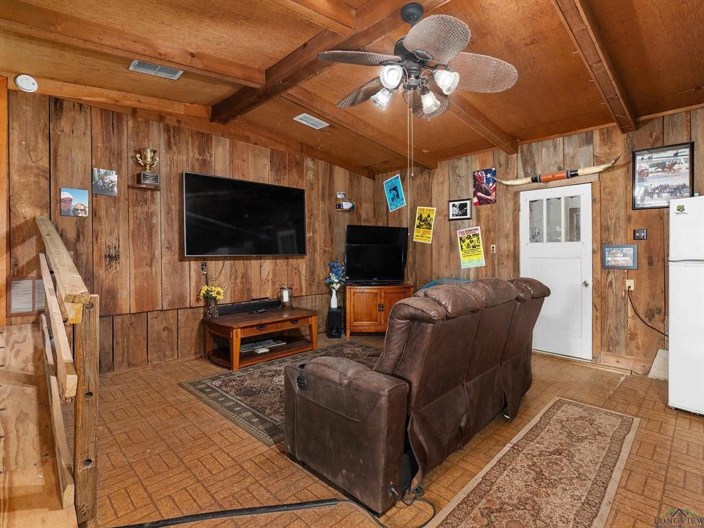 6006 Highway 315 Carthage, TX 75633 - Photo 9 of 35 a living room with furniture and a flat screen tv