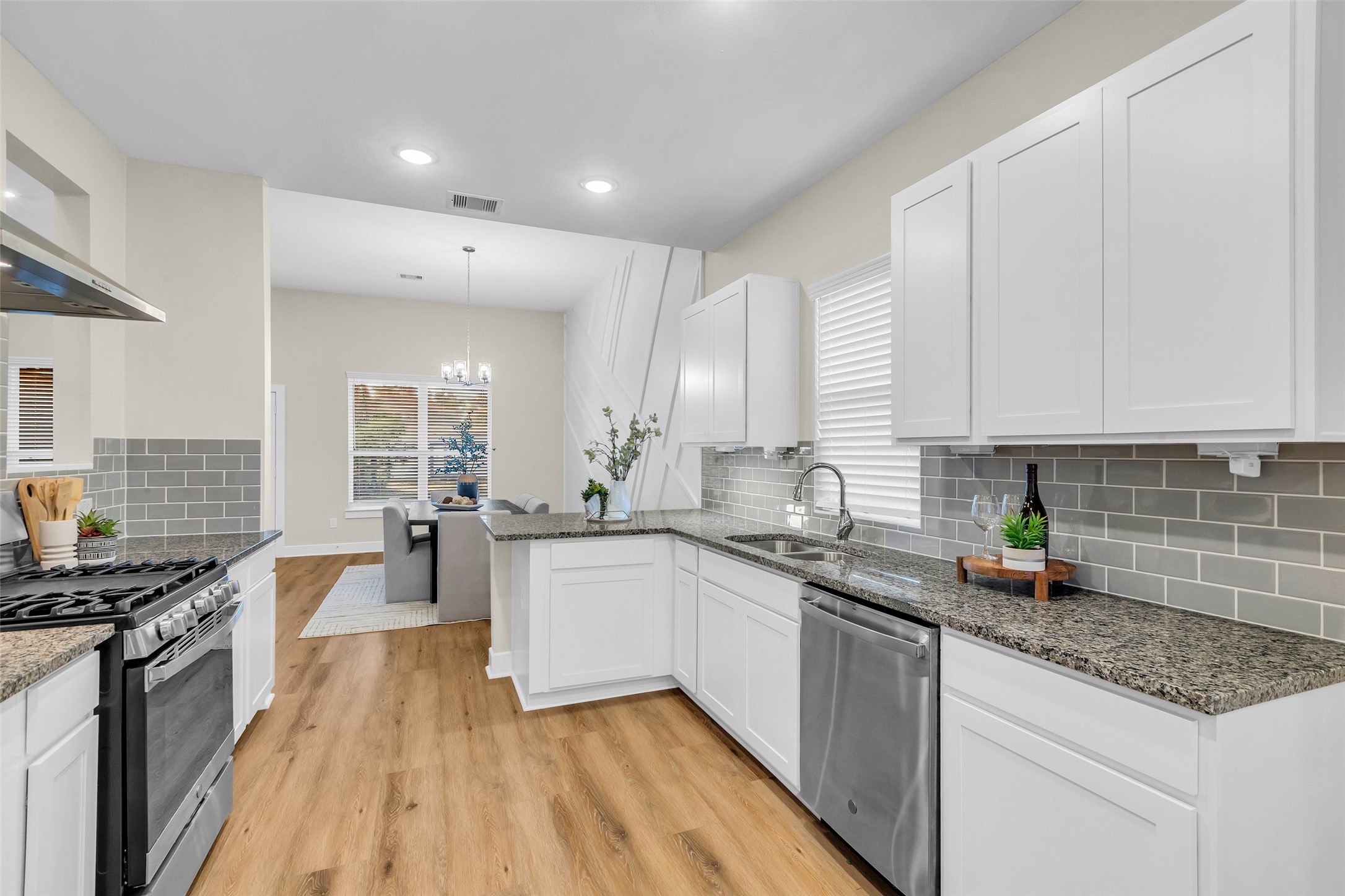 12341 North Chestnut Hills Road Conroe, TX 77303 - Photo 11 of 43 Features an upgraded subway tile backsplash for a timeless, stylish look.