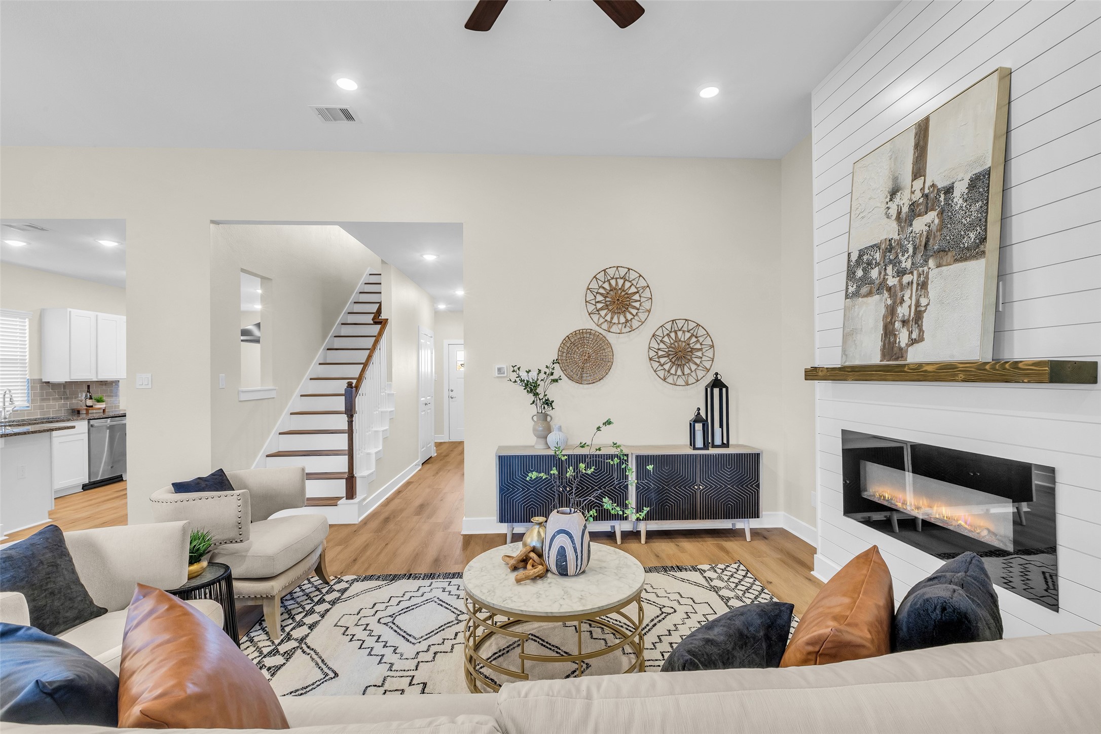 12341 North Chestnut Hills Road Conroe, TX 77303 - Photo 20 of 43 Situated down a gracious hallway from the front entrance, the living room offers a sense of privacy while opening into a bright and welcoming space.