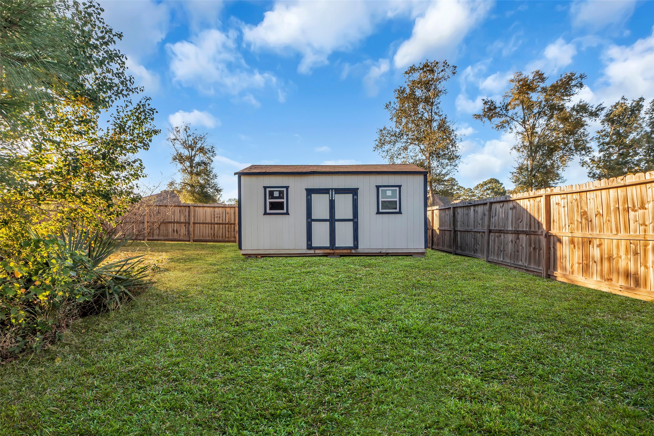 12341 North Chestnut Hills Road Conroe, TX 77303 - Photo 34 of 43 The she-shed is located at the back end of the backyard.