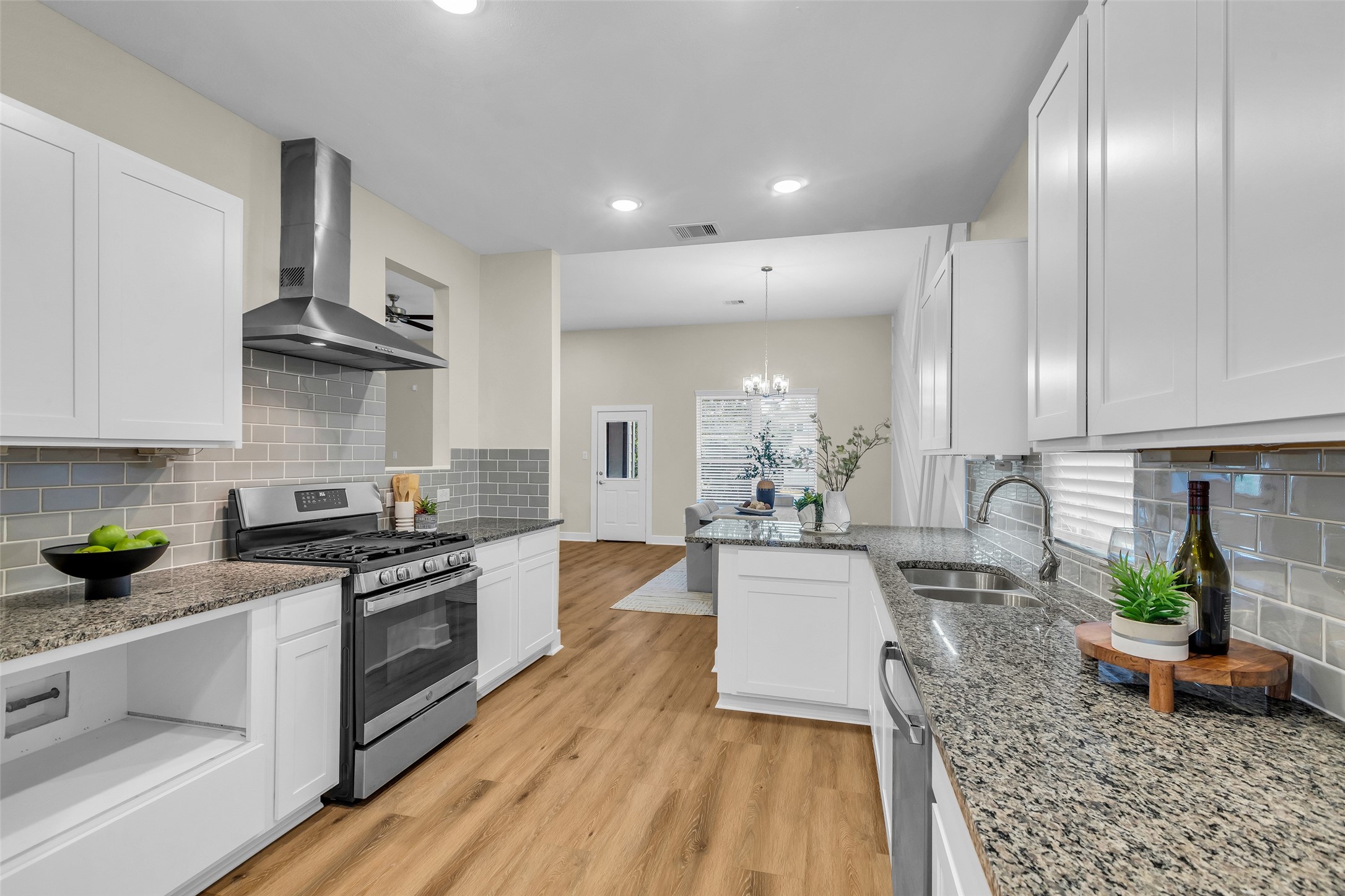 12341 North Chestnut Hills Road Conroe, TX 77303 - Photo 10 of 43 You'll love cooking in this kitchen with the upgraded vent hood and plenty of cabinet space.