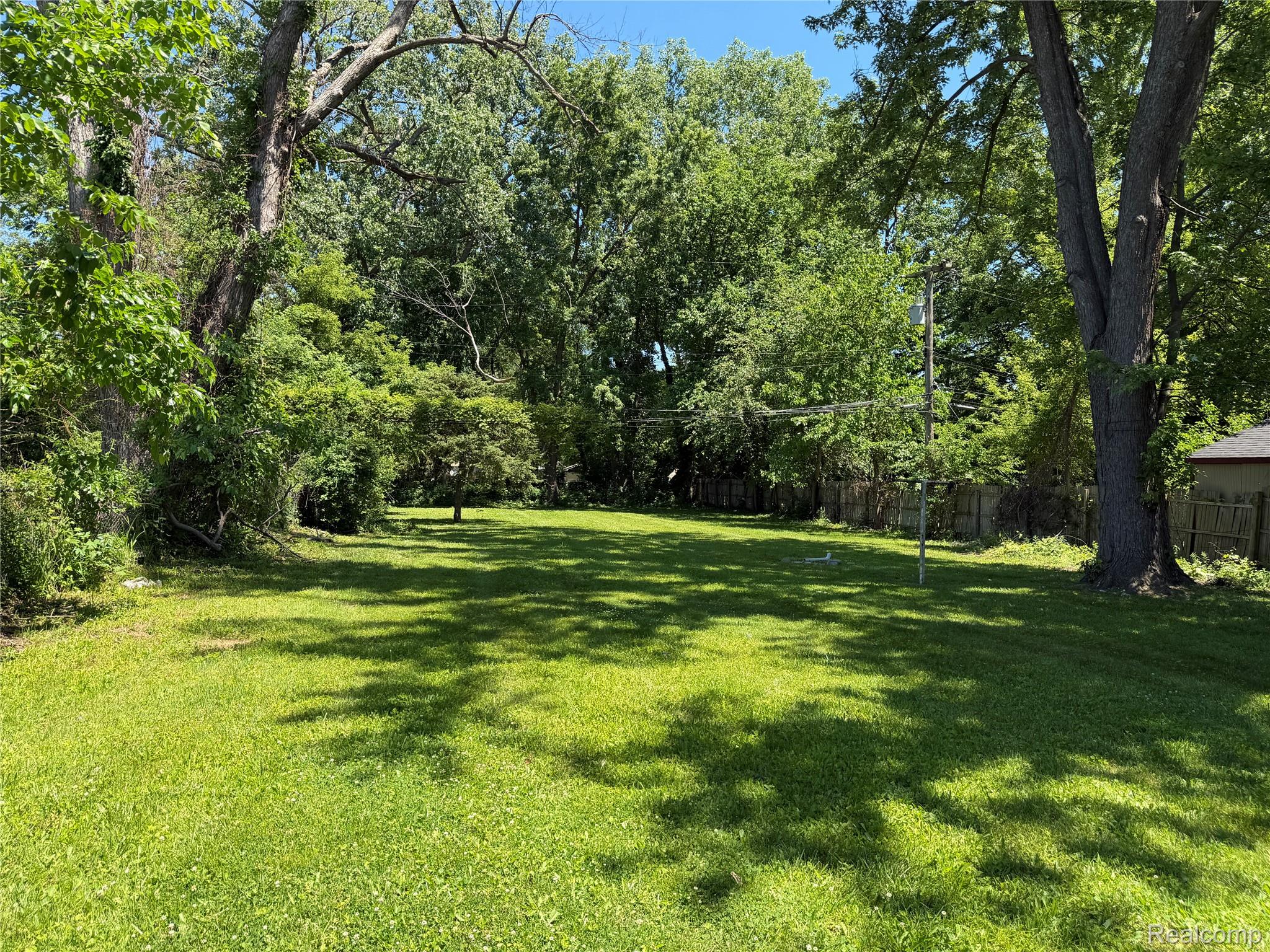 6237 Inkster Road Taylor, MI 48180 - Photo 2 of 14 Expansive outdoor space featuring a lush lawn and mature trees