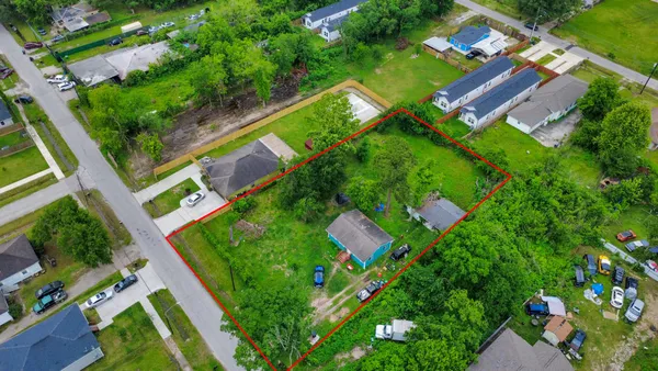 an aerial view of green landscape with chairs