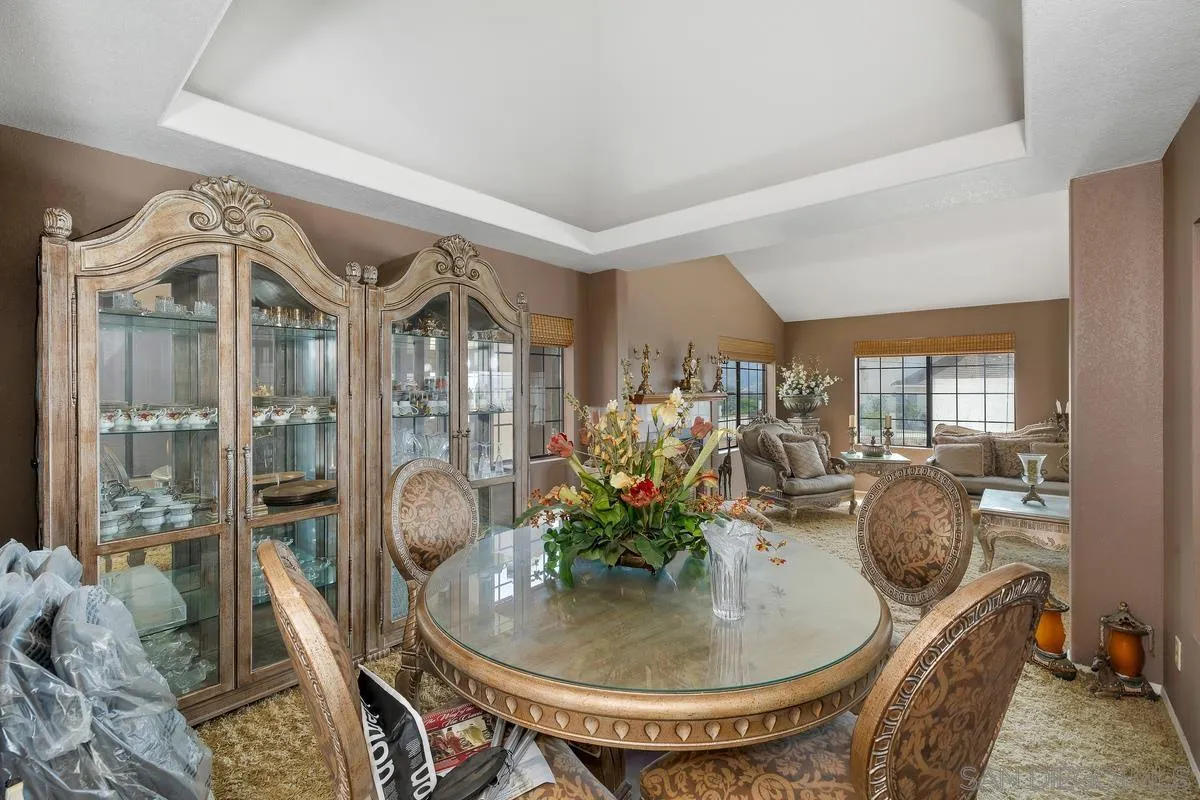 14650 Alkosh Road Jamul, CA 91935 - Photo 11 of 35 a dining room with furniture and chandelier