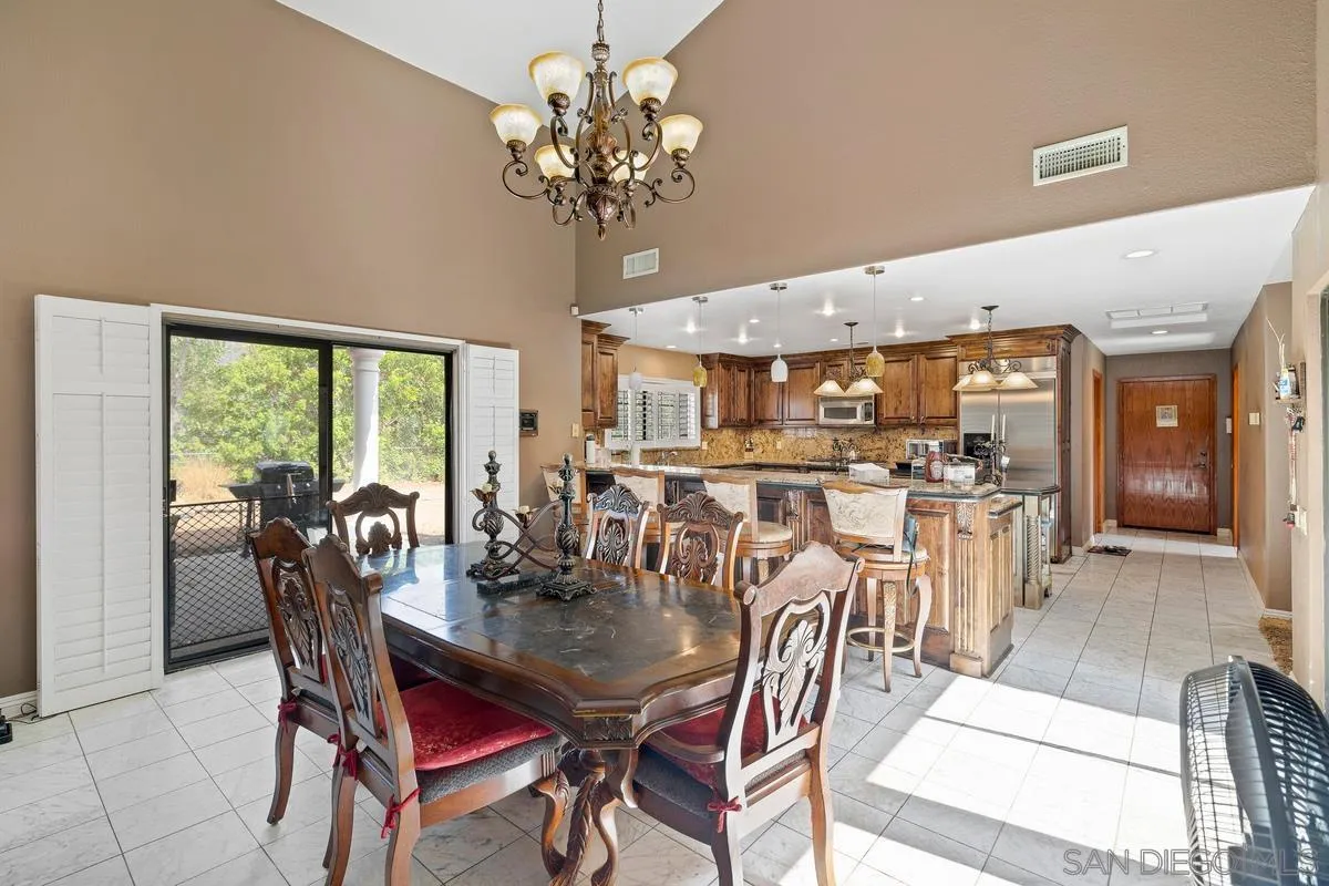 14650 Alkosh Road Jamul, CA 91935 - Photo 13 of 35 a view of a dining room with furniture window and outside view