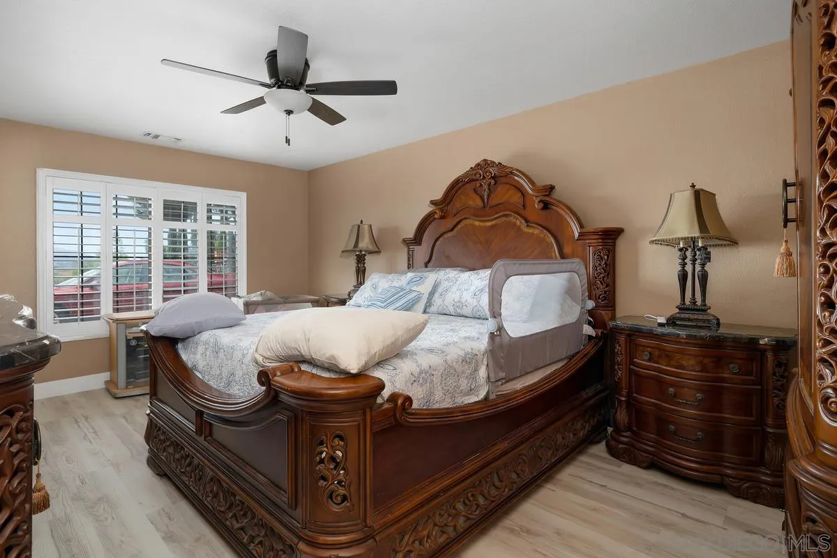 14650 Alkosh Road Jamul, CA 91935 - Photo 20 of 35 a bed sitting in a bedroom next to a window