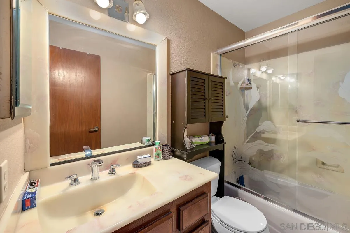 14650 Alkosh Road Jamul, CA 91935 - Photo 22 of 35 a bathroom with a sink toilet and shower