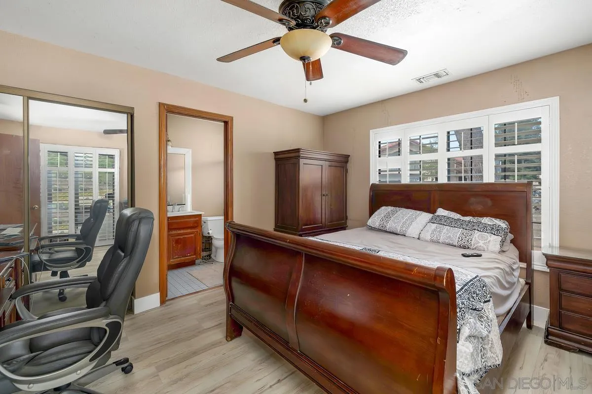 14650 Alkosh Road Jamul, CA 91935 - Photo 23 of 35 a bed room with a bed and a window