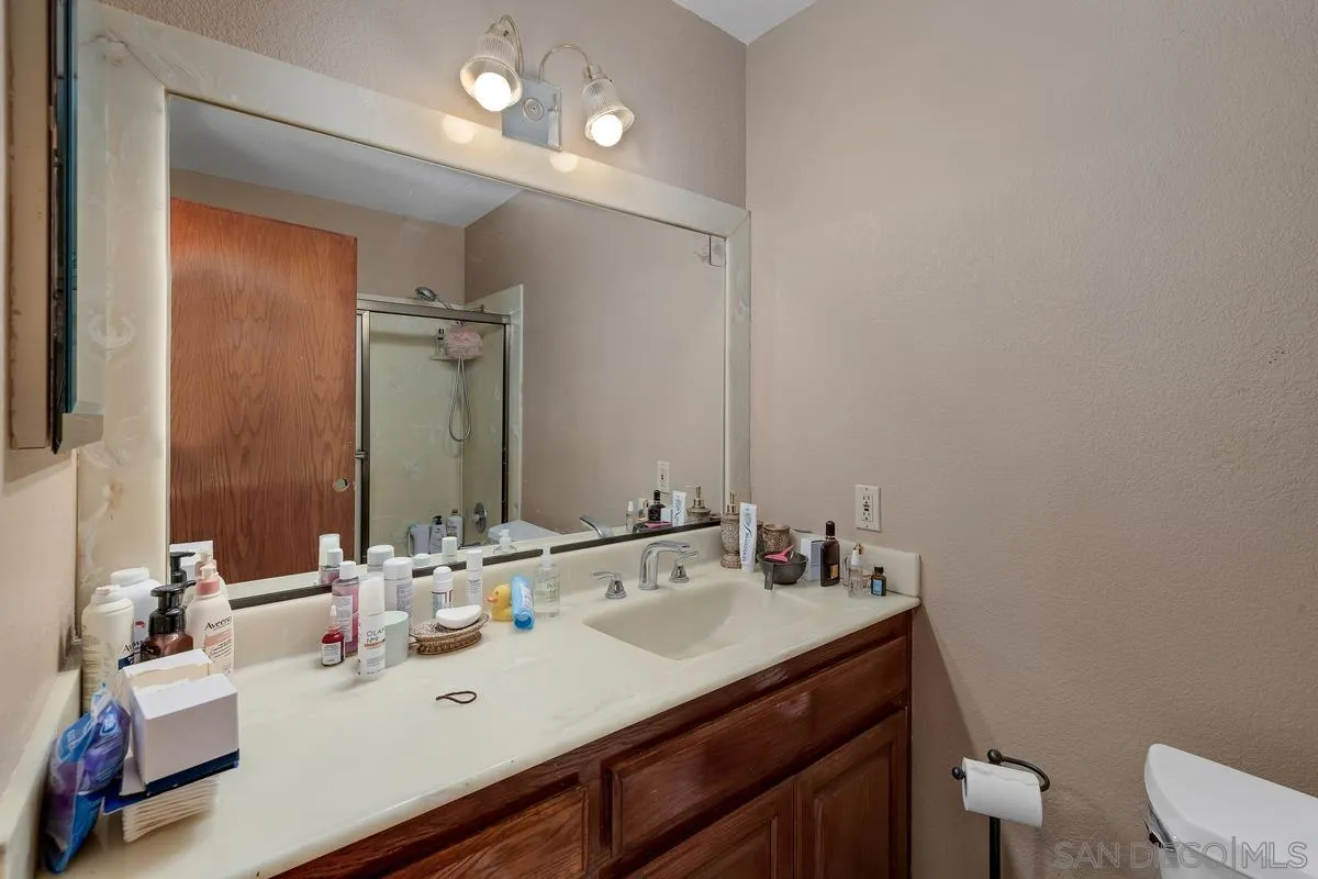 14650 Alkosh Road Jamul, CA 91935 - Photo 24 of 35 a bathroom with a sink vanity and a toilet
