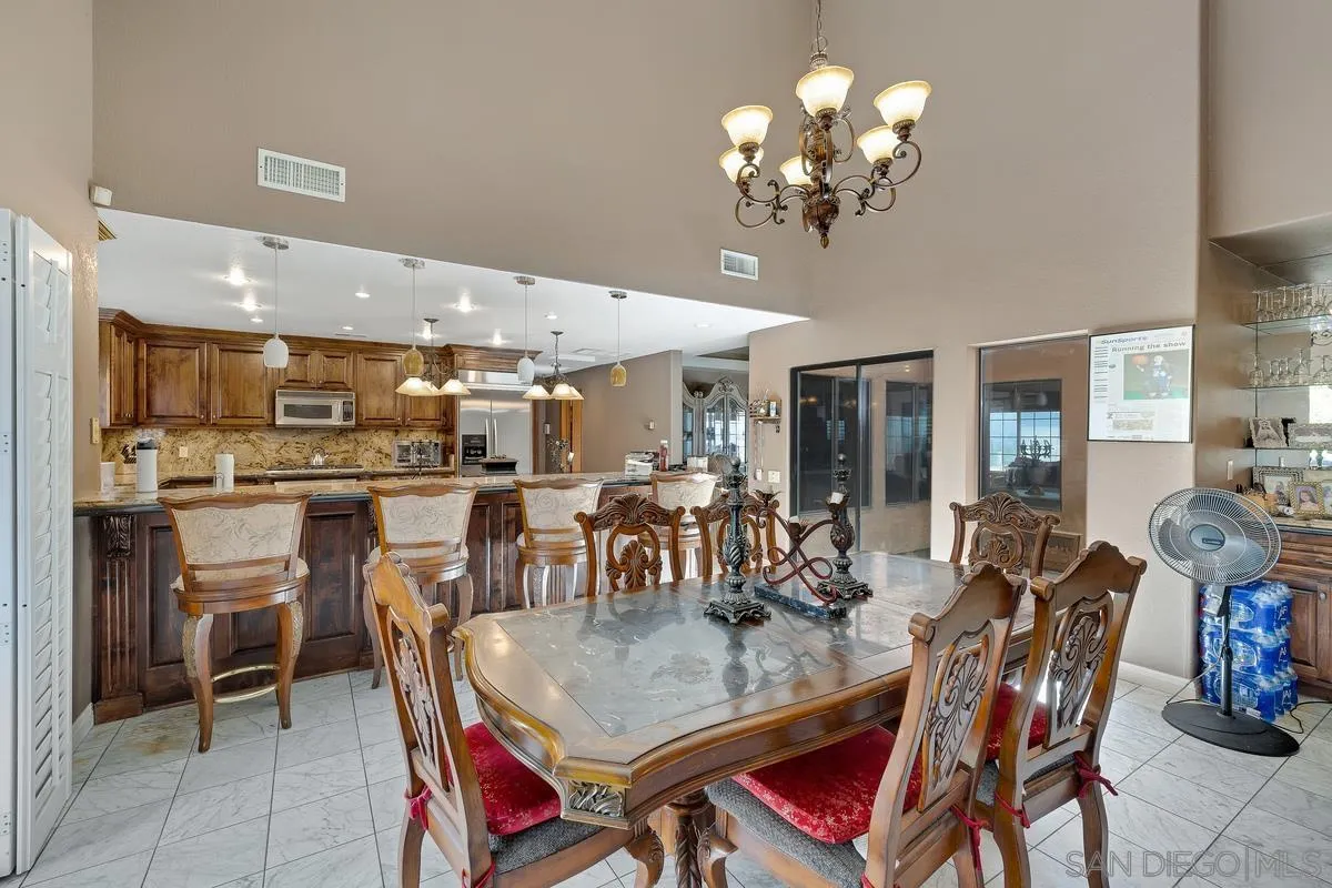 14650 Alkosh Road Jamul, CA 91935 - Photo 6 of 35 a view of a dining room with furniture and chandelier