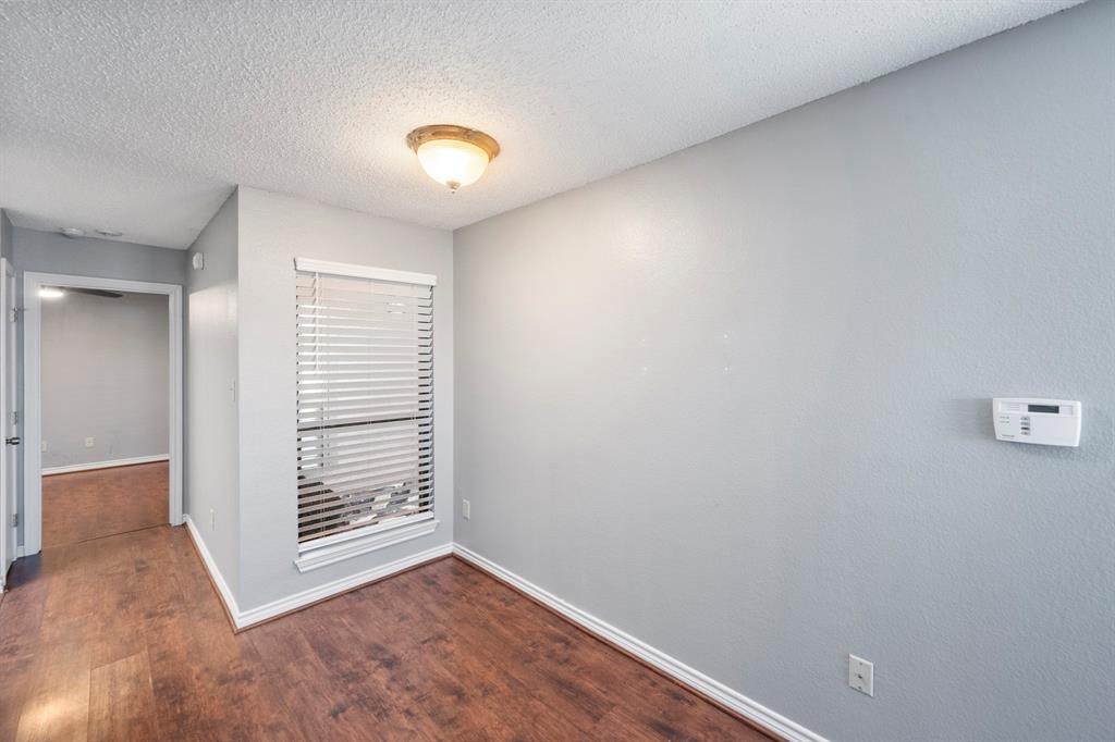 1712 Baird Farm Circle, Unit 2101 Arlington, TX 76006 - Photo 13 of 30 a view of an empty room with a window