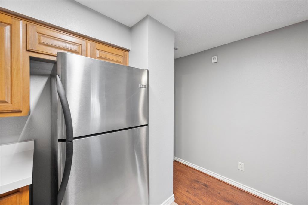 1712 Baird Farm Circle, Unit 2101 Arlington, TX 76006 - Photo 17 of 30 a view of a refrigerator in a kitchen