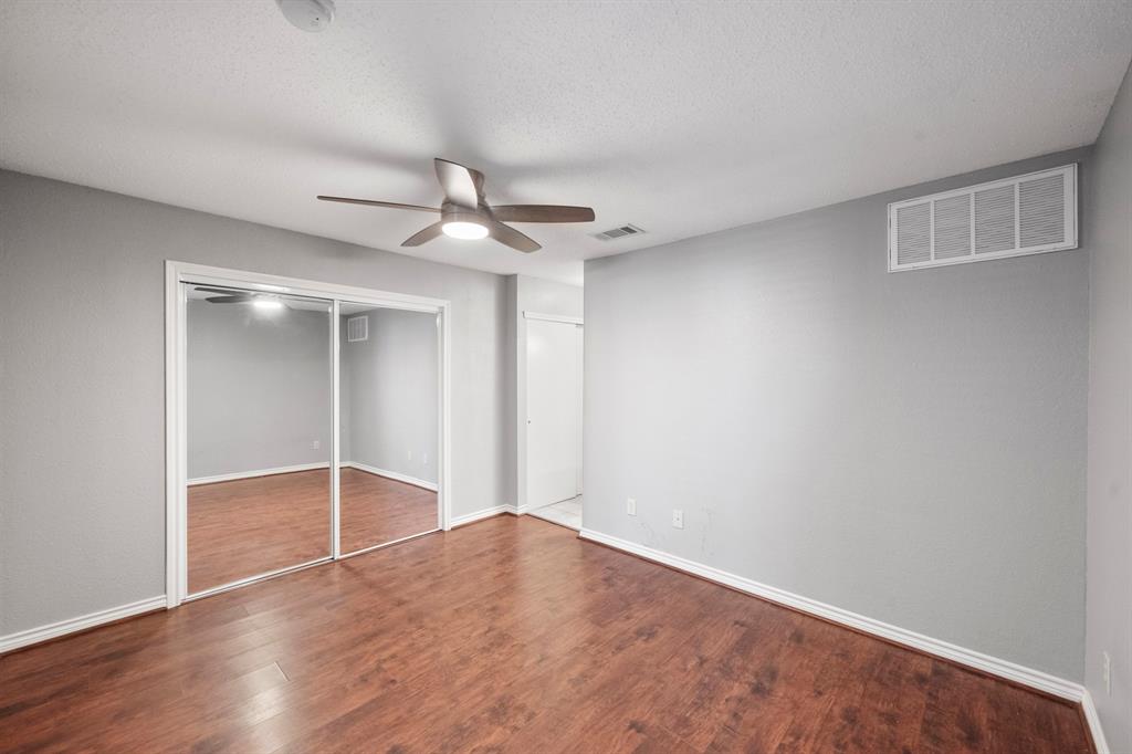 1712 Baird Farm Circle, Unit 2101 Arlington, TX 76006 - Photo 20 of 30 wooden floor in an empty room