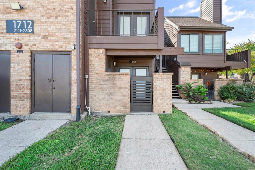 1712 Baird Farm Circle, Unit 2101 Arlington, TX 76006 - Photo 2 of 30 a front view of a house with garden