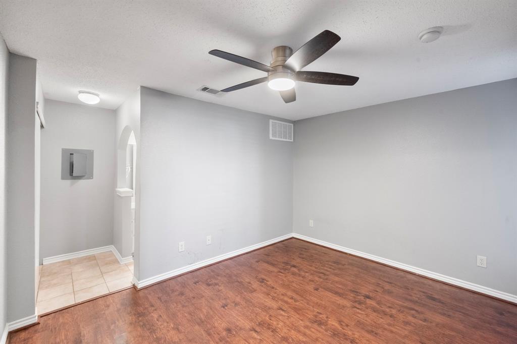 1712 Baird Farm Circle, Unit 2101 Arlington, TX 76006 - Photo 21 of 30 wooden floor in an empty room