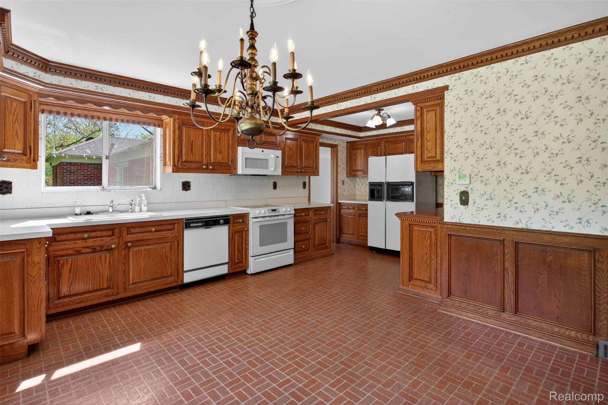 15623 Millar Road Clinton Township, MI 48036 - Photo 42 of 56 Kitchen with brick patterned flooring, white appliances, suspended lighting, wood finish cabinets, and wallpapered walls