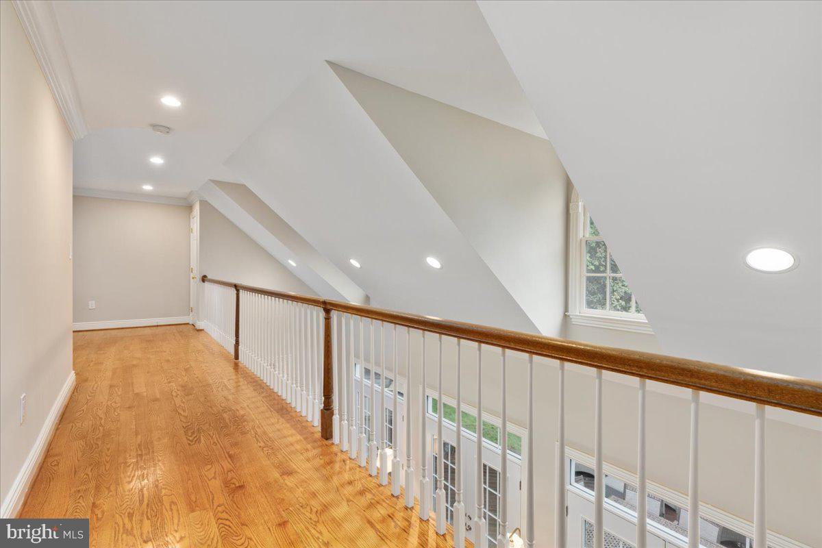 14915 Alpine Bay Loop Gainesville, VA 20155 - Photo 53 of 105 a view of a hallway with wooden floor
