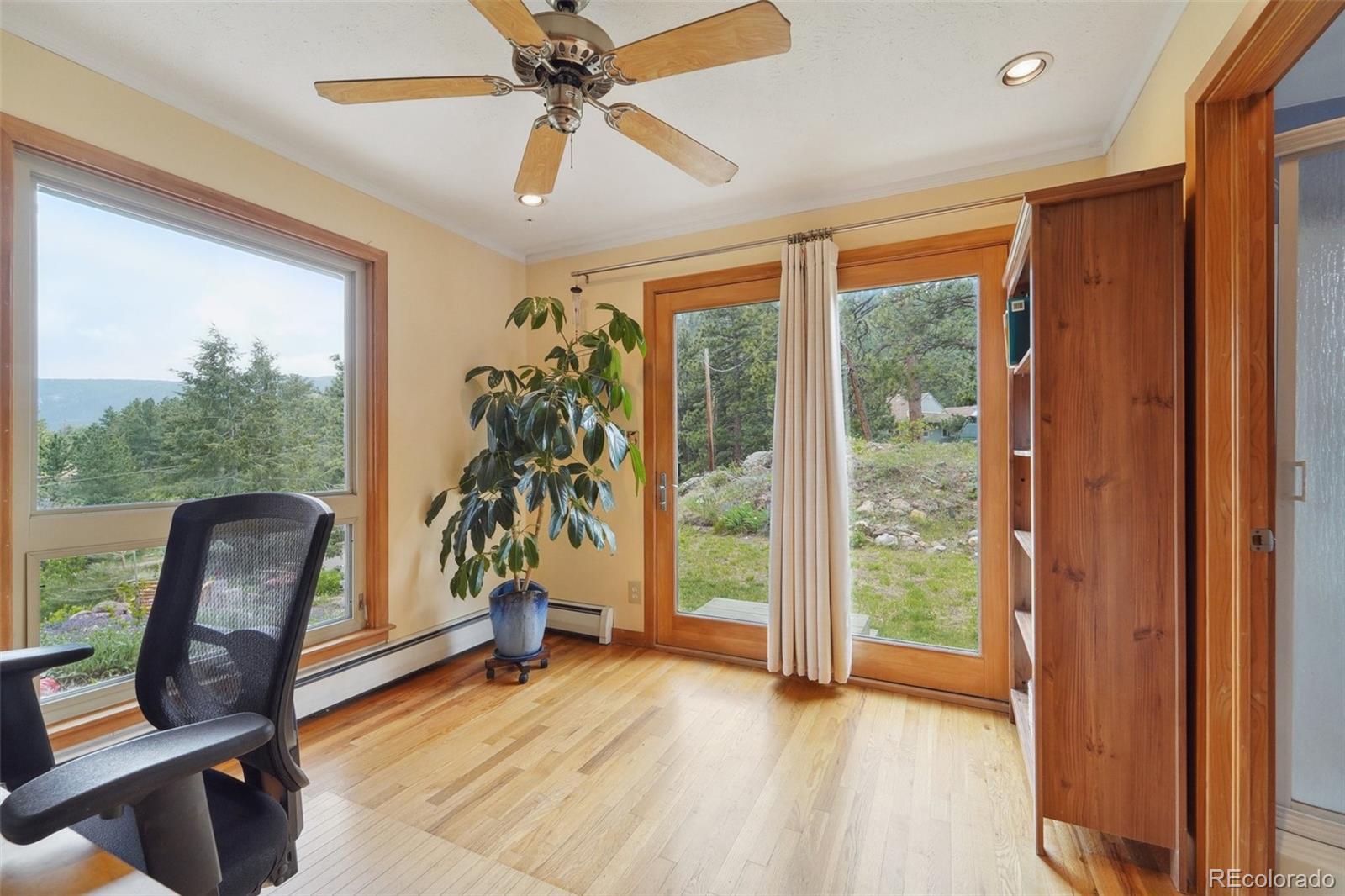 855 Kelly Road West Boulder, CO 80302 - Photo 14 of 40 a view of workspace with wooden floor and windows