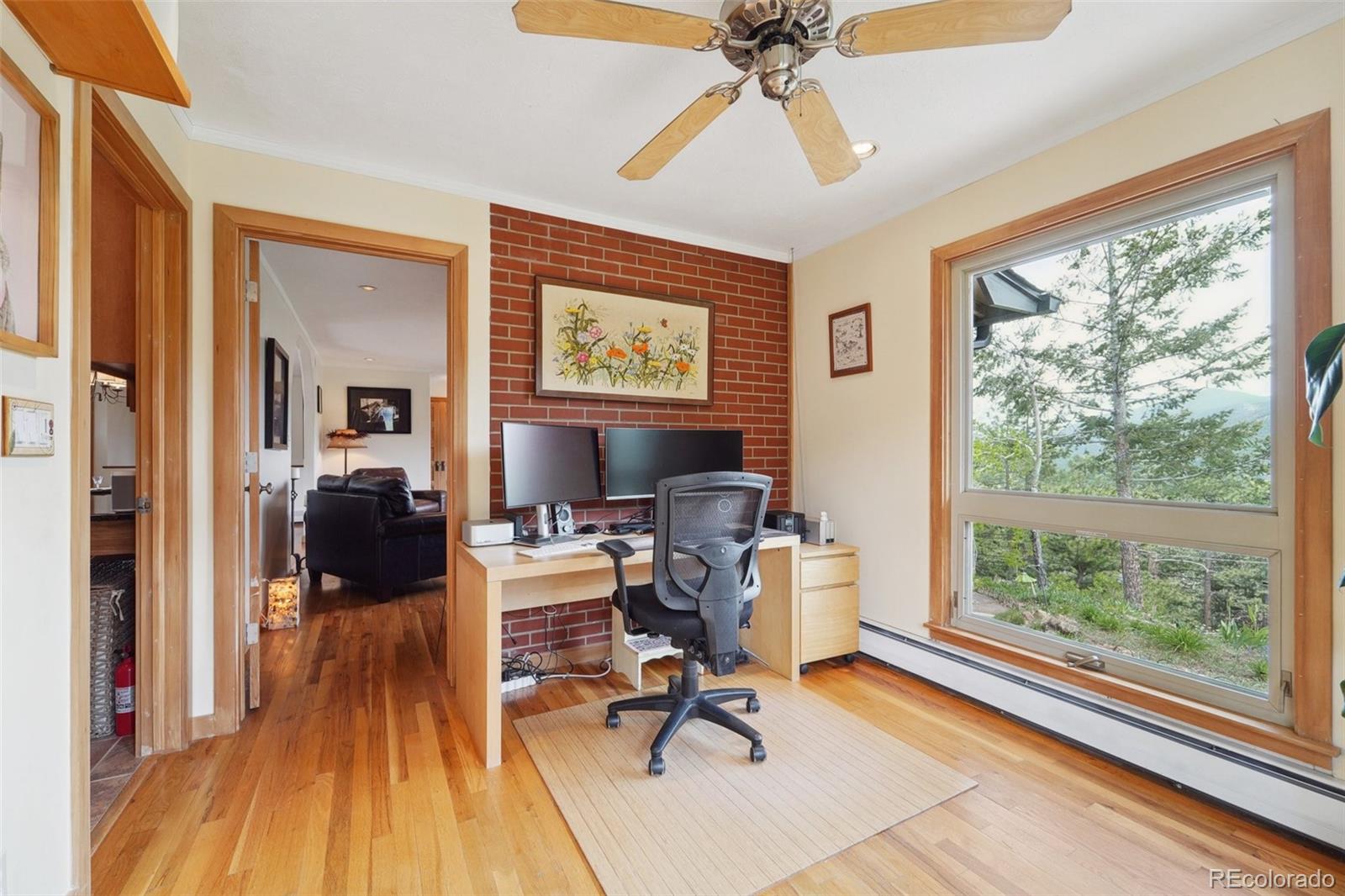 855 Kelly Road West Boulder, CO 80302 - Photo 15 of 40 a view of a livingroom with workspace and a window
