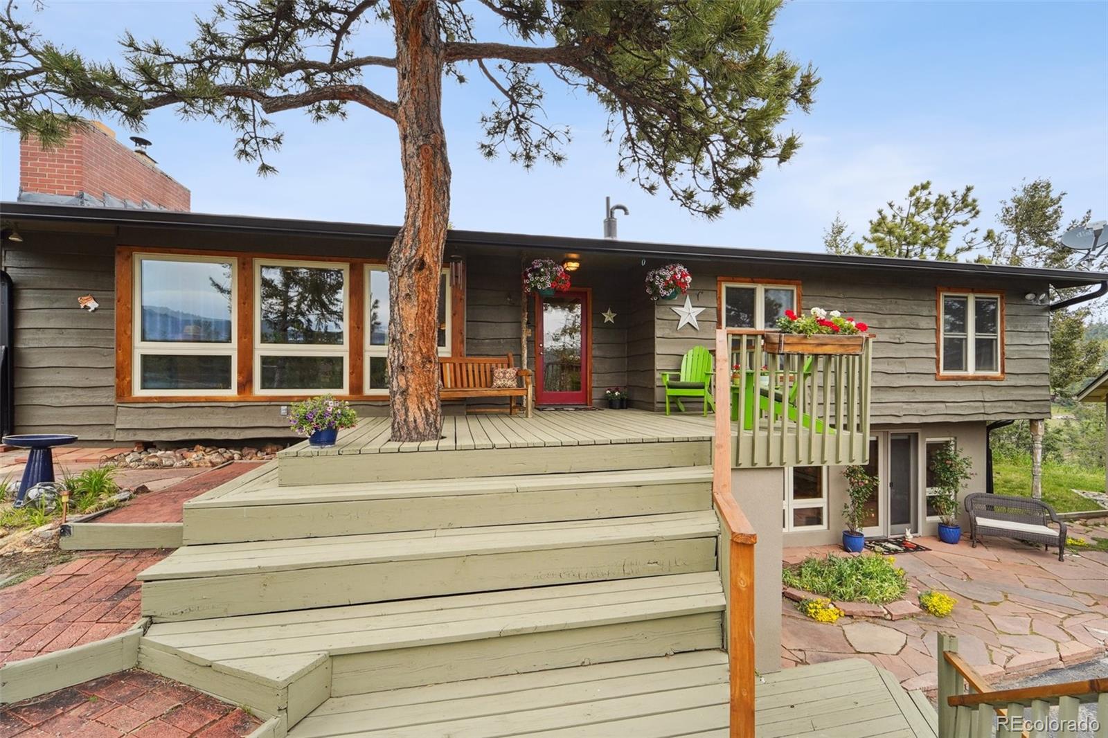 855 Kelly Road West Boulder, CO 80302 - Photo 2 of 40 a front view of a house with a porch