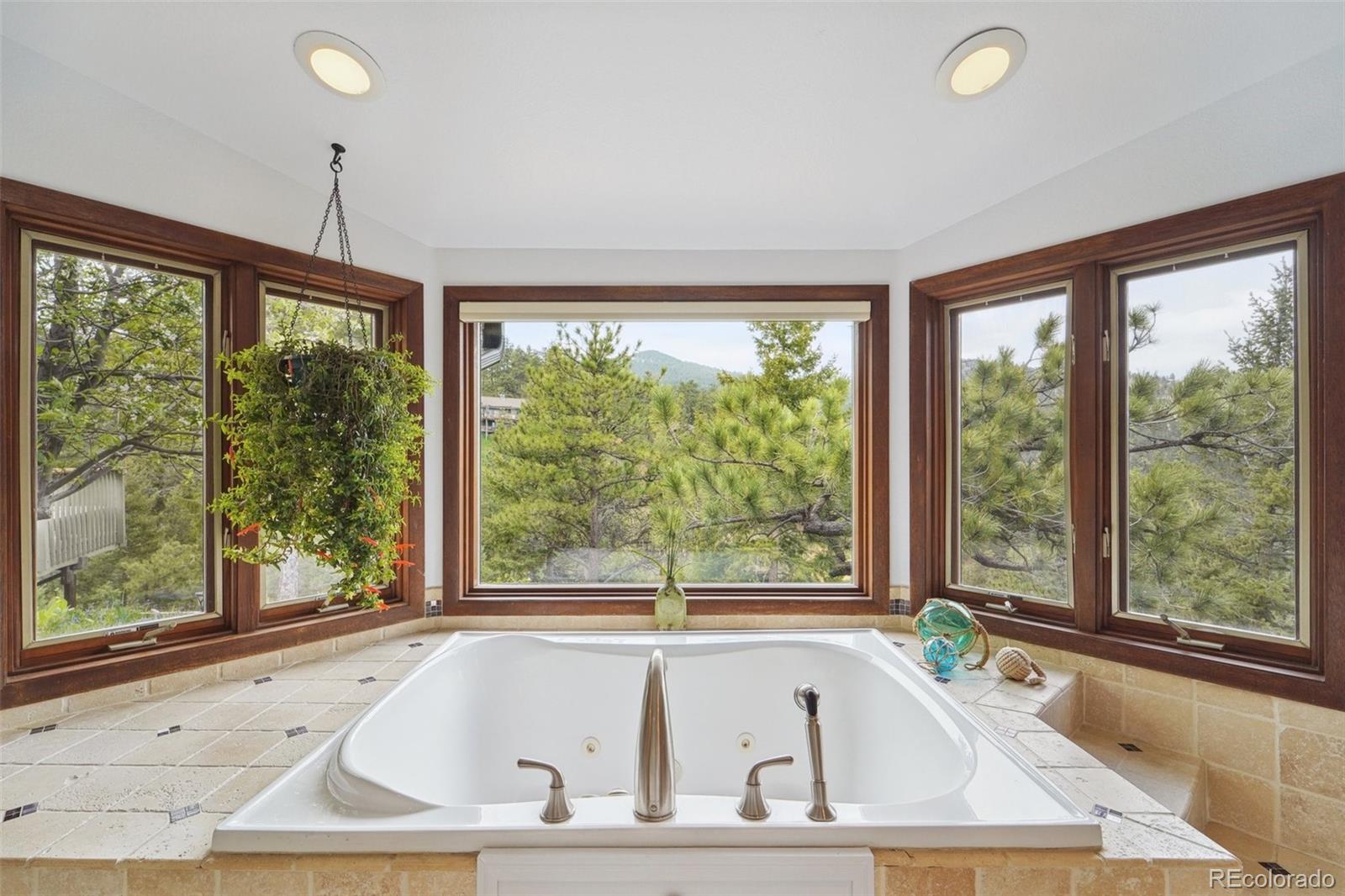 855 Kelly Road West Boulder, CO 80302 - Photo 21 of 40 a bathroom with a tub and a large window