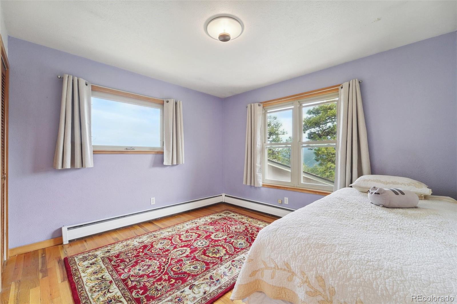 855 Kelly Road West Boulder, CO 80302 - Photo 23 of 40 a bedroom with a bed and a window