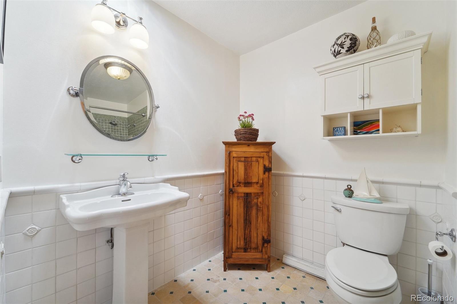 855 Kelly Road West Boulder, CO 80302 - Photo 24 of 40 a bathroom with a toilet sink and mirror