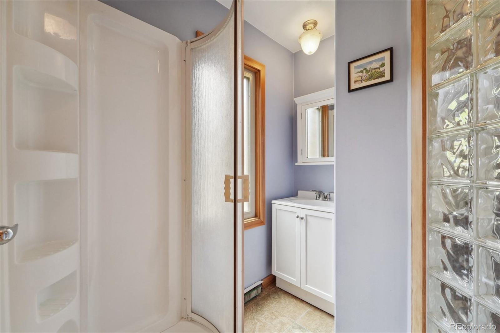 855 Kelly Road West Boulder, CO 80302 - Photo 28 of 40 a bathroom with a bathtub and a shower