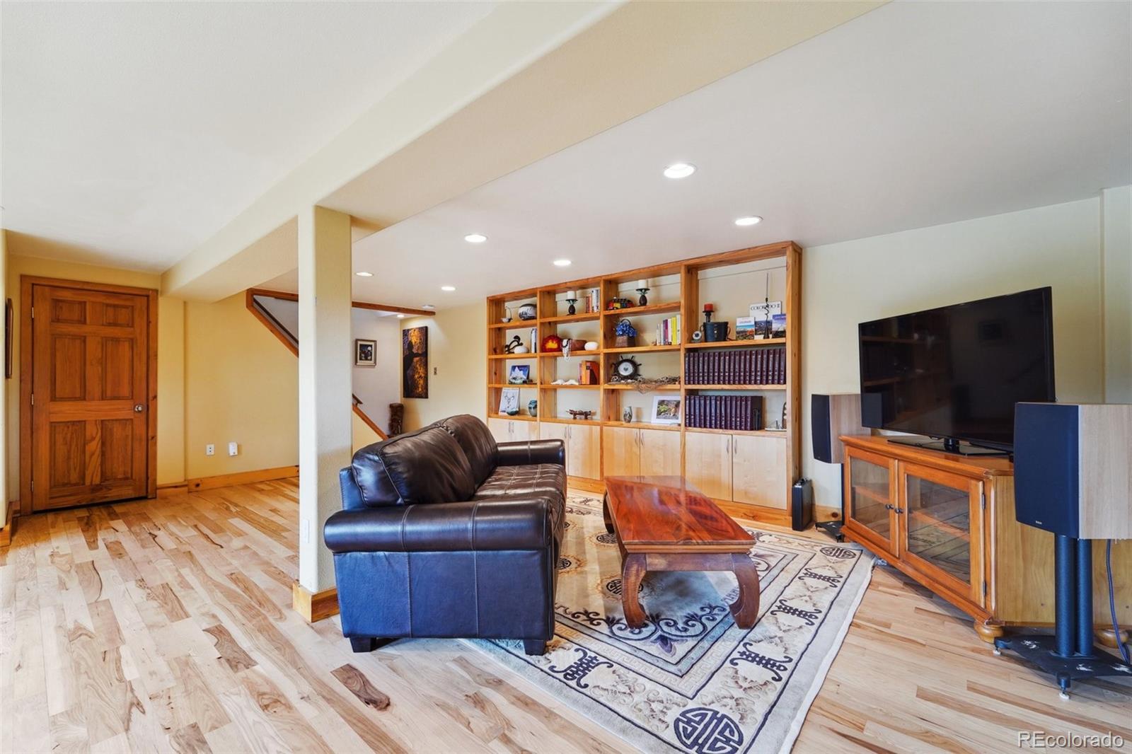 855 Kelly Road West Boulder, CO 80302 - Photo 29 of 40 a living room with furniture and a flat screen tv