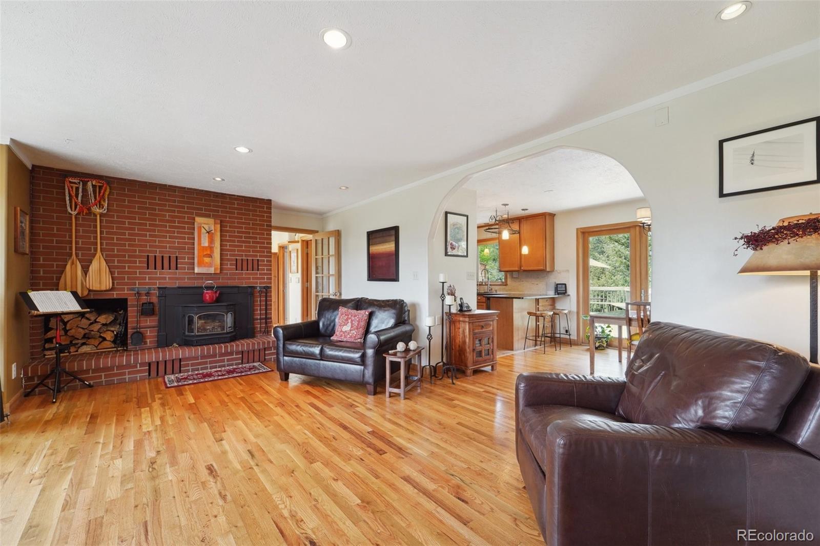 855 Kelly Road West Boulder, CO 80302 - Photo 3 of 40 a living room with furniture and a wooden floor