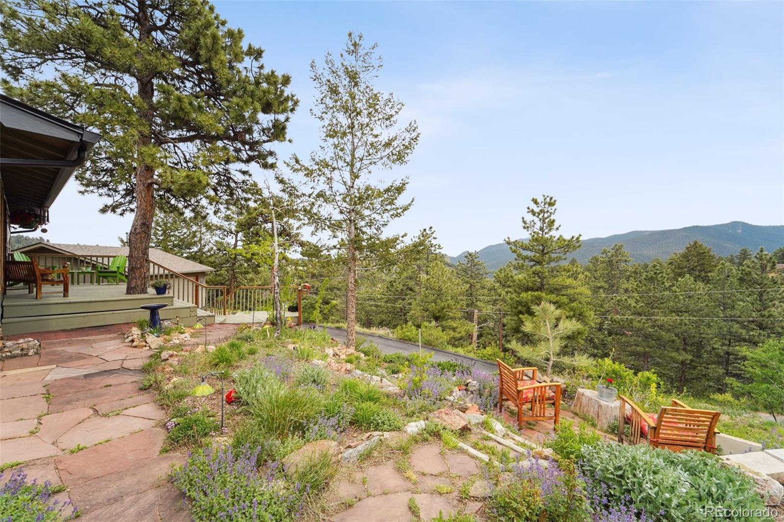 855 Kelly Road West Boulder, CO 80302 - Photo 33 of 40 a view of a yard with plants and large trees