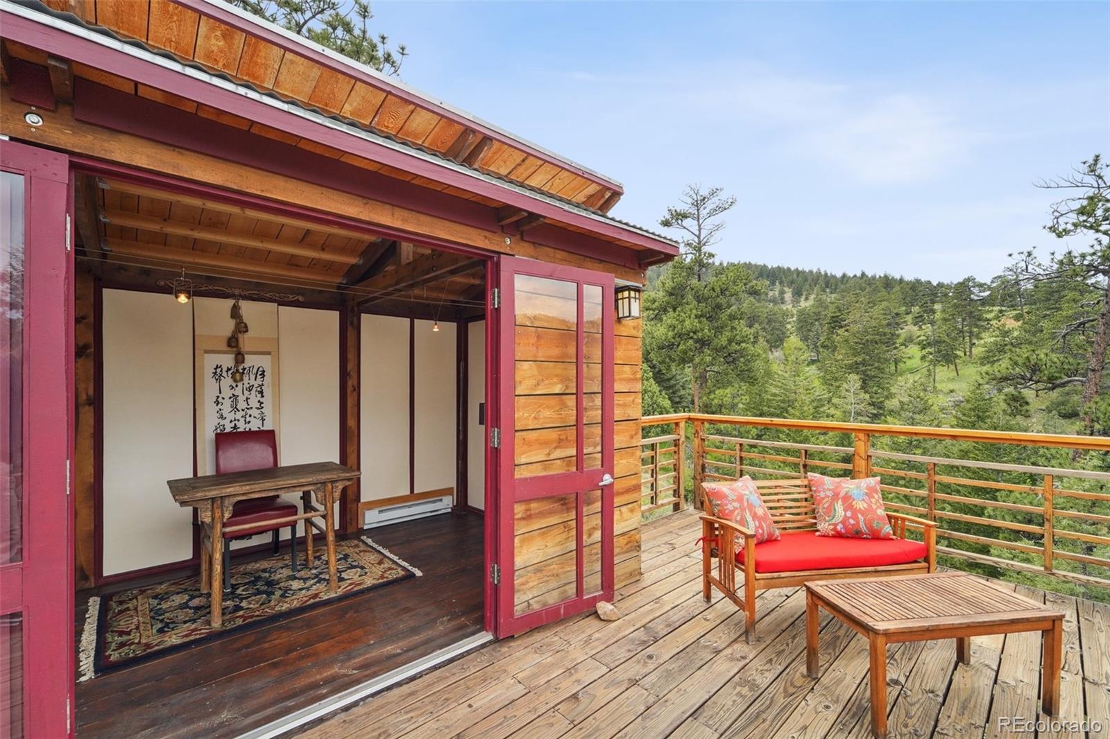 855 Kelly Road West Boulder, CO 80302 - Photo 36 of 40 a roof deck with table and chairs