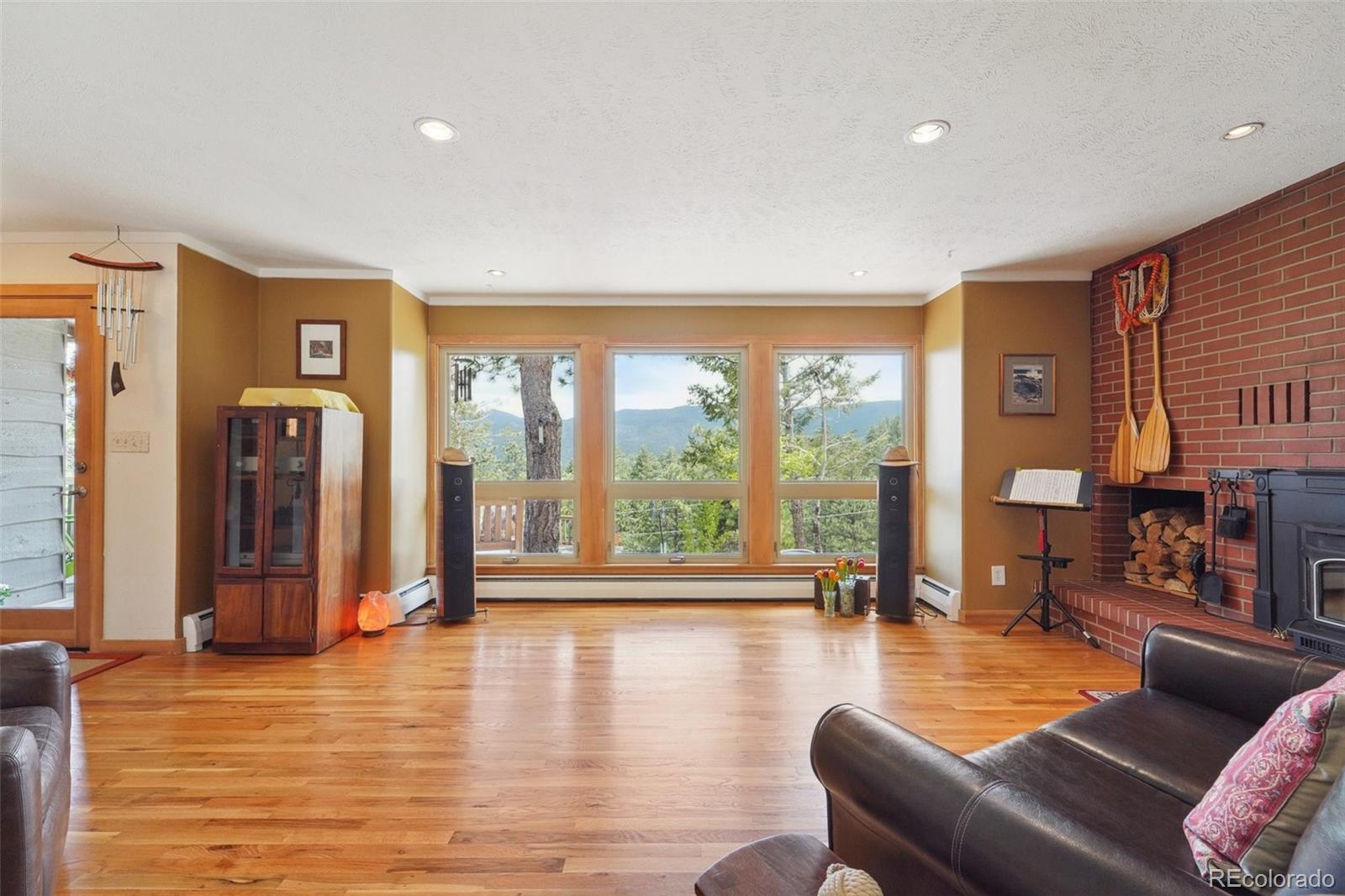 855 Kelly Road West Boulder, CO 80302 - Photo 4 of 40 a living room with furniture and large windows