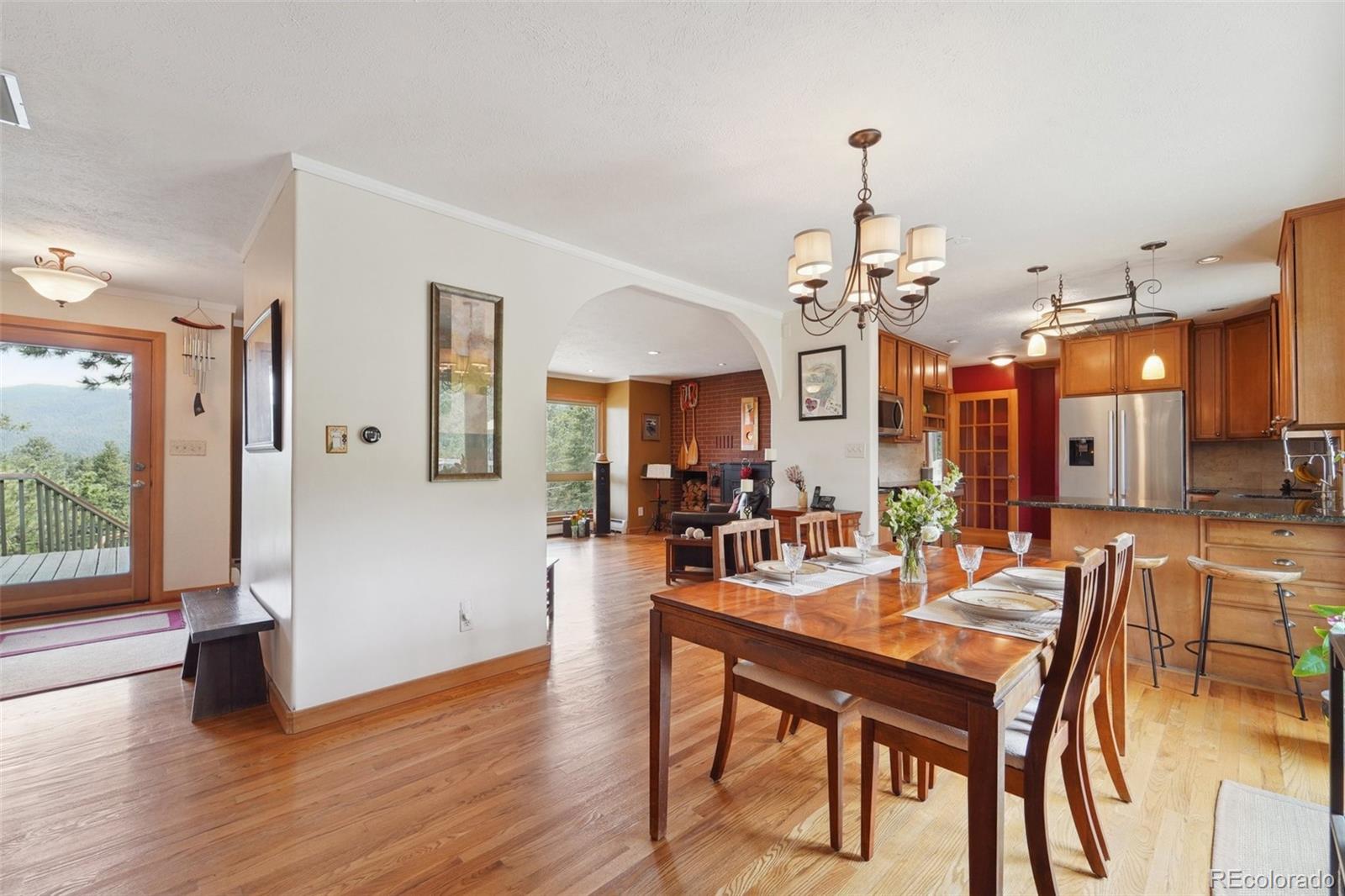 855 Kelly Road West Boulder, CO 80302 - Photo 8 of 40 a view of a dining room with furniture window and wooden floor