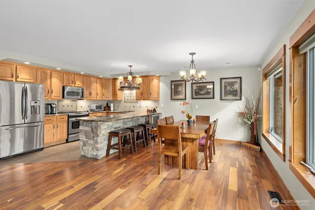 a view of a dining room with furniture window and wooden floor