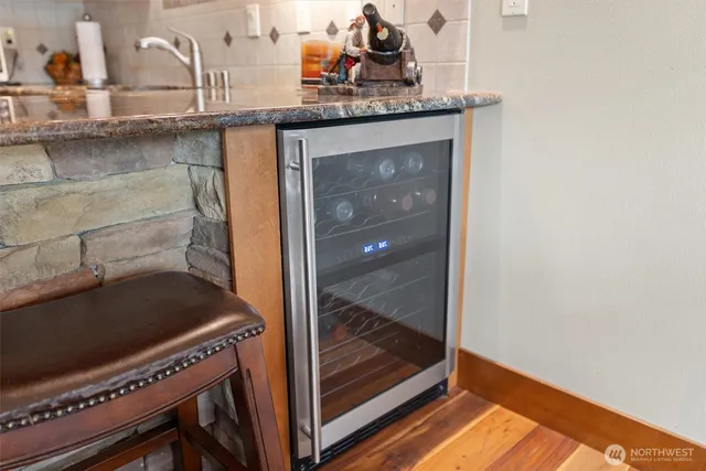 a room with a stove and a mirror