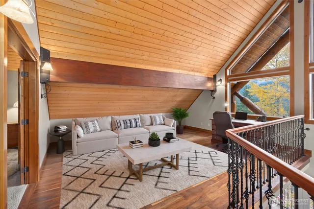 a view of balcony with wooden floor and outdoor seating