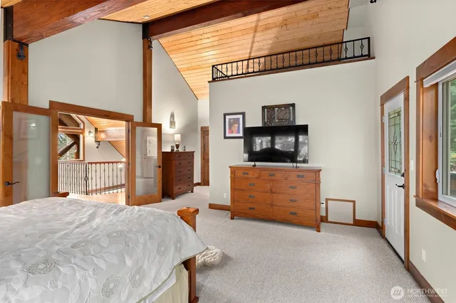 a bathroom with a granite countertop double vanity sink and mirror