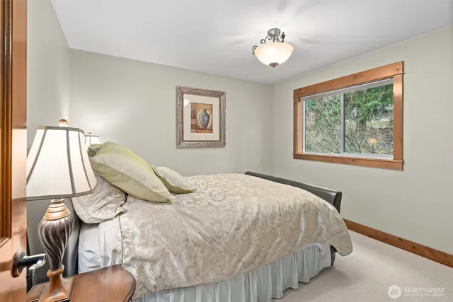 a bathroom with a granite countertop sink double vanity and bathtub