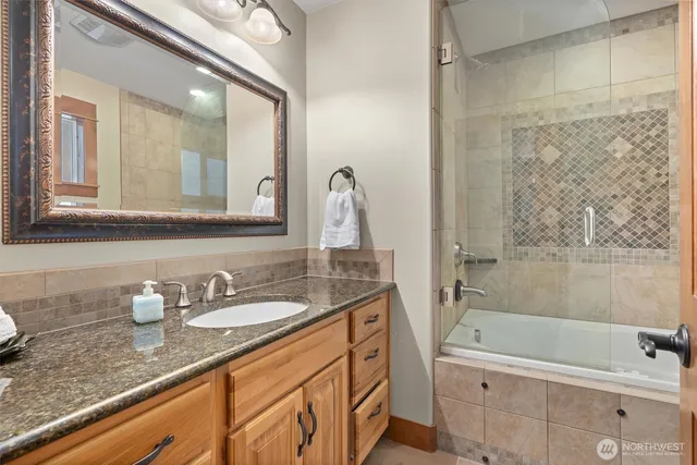 a bedroom with a bed with window