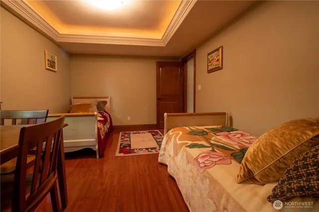 a bedroom with a bed and a lounge chair