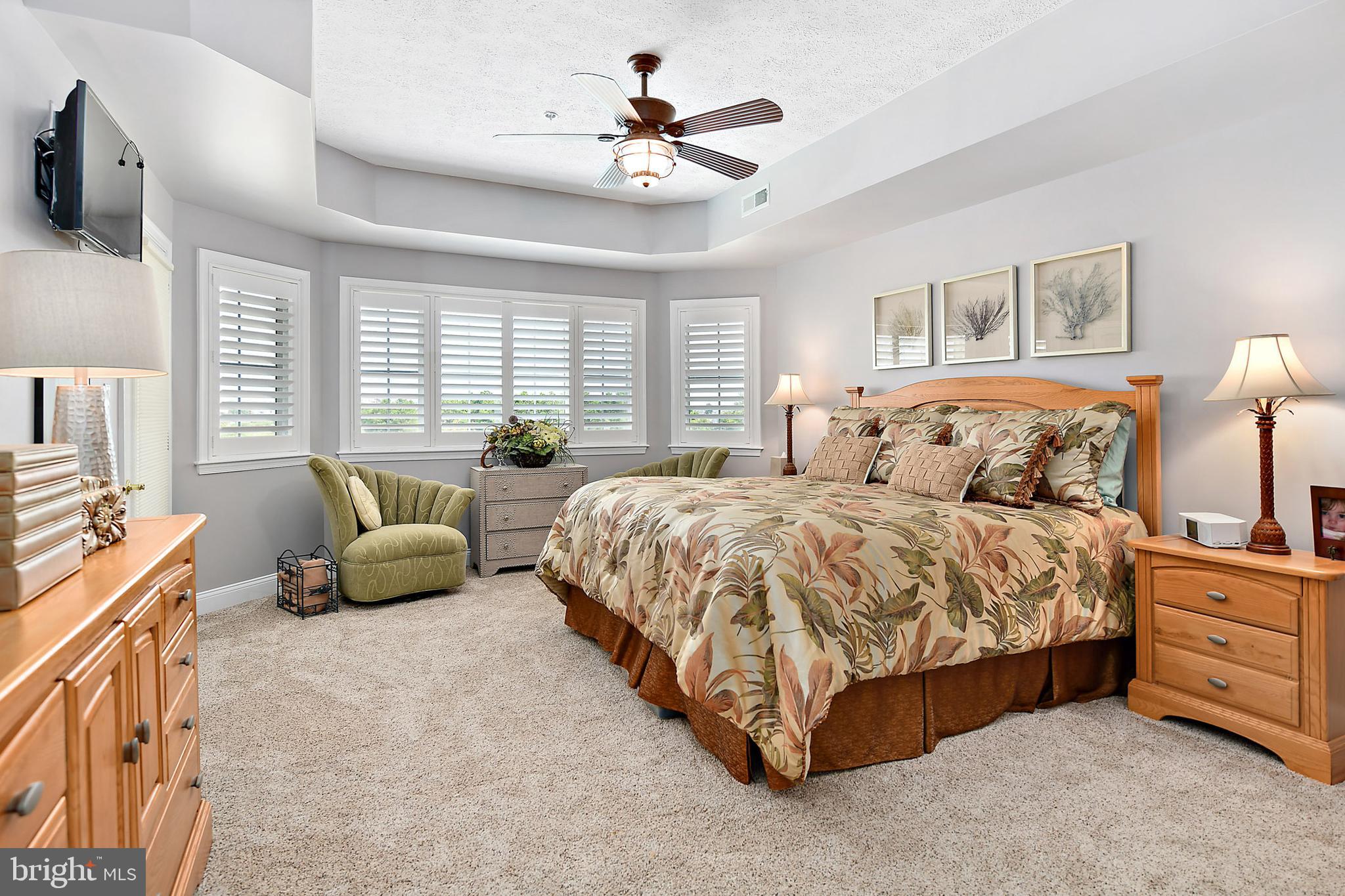 9742 Golf Course Road, Unit 202 Ocean City, MD 21842 - Photo 21 of 36 The Master Bedroom King Sized Bed & Lounge Area