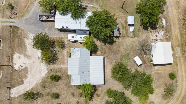 an aerial view of a house with outdoor space