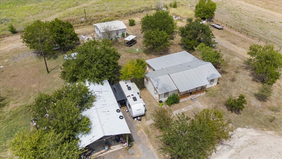 19016 Farm To Market Road 973 Coupland, TX 78615 - Photo 10 of 18 an aerial view of a house with a yard and lake view