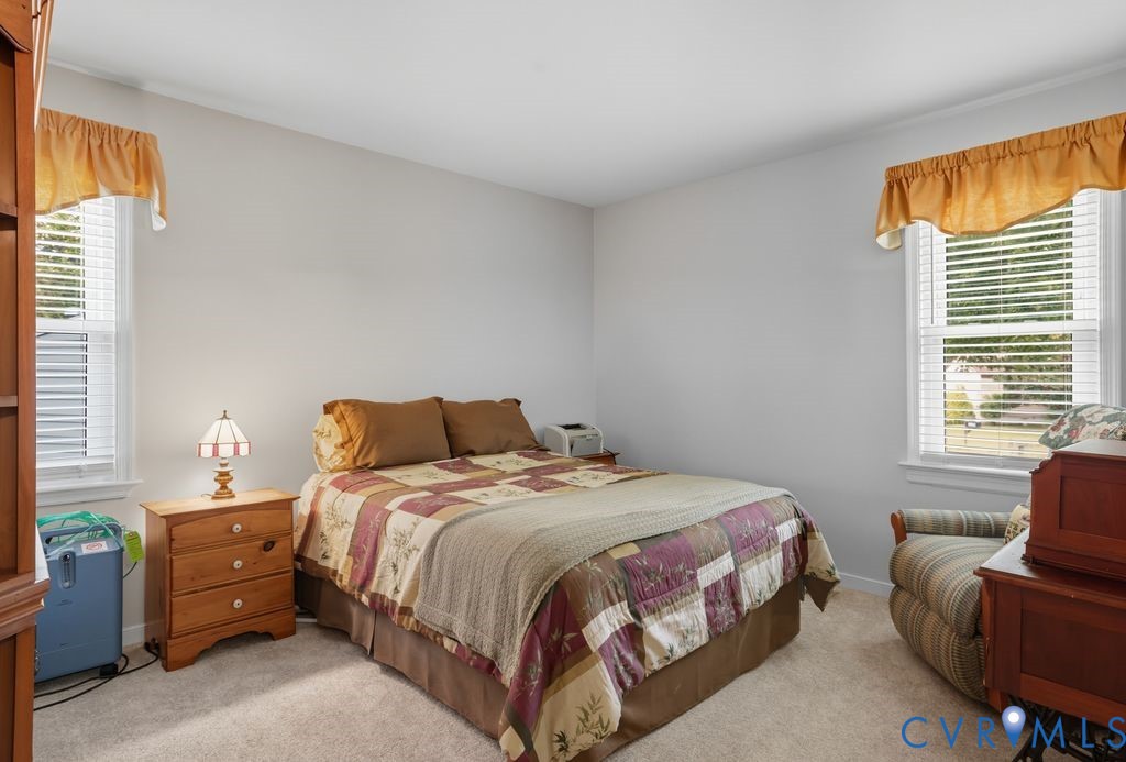 3403 Fallbrooke Court North Chesterfield, VA 23235 - Photo 16 of 23 a bedroom with a bed chair and a window