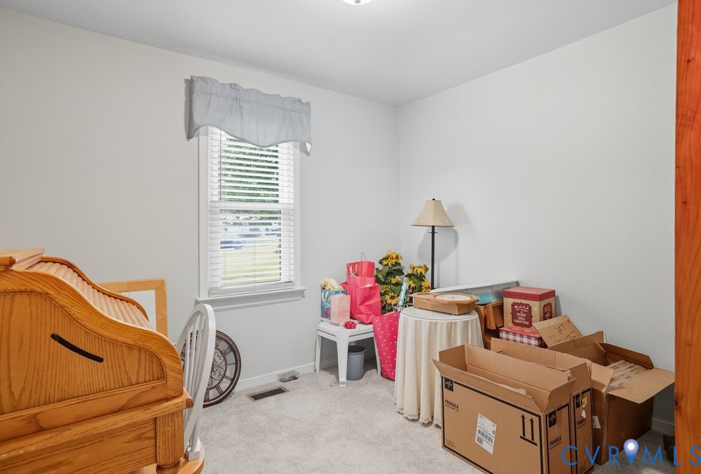 3403 Fallbrooke Court North Chesterfield, VA 23235 - Photo 18 of 23 a bedroom with a bed and wooden floor