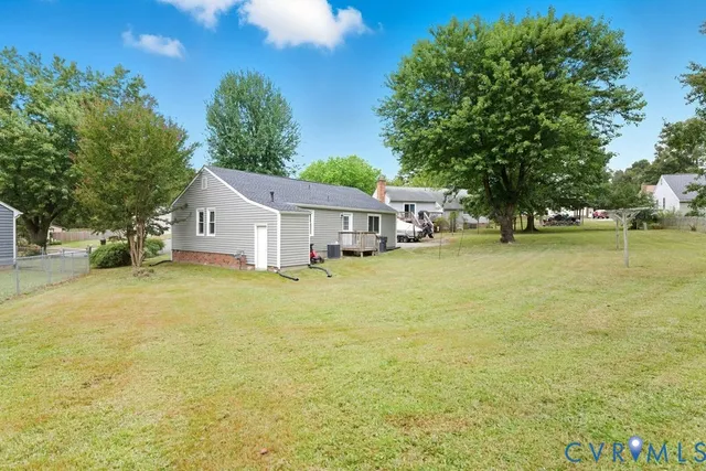 a house view with swimming pool in front of it