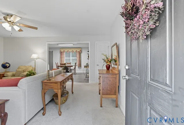 a view of a livingroom with furniture window and wooden floor