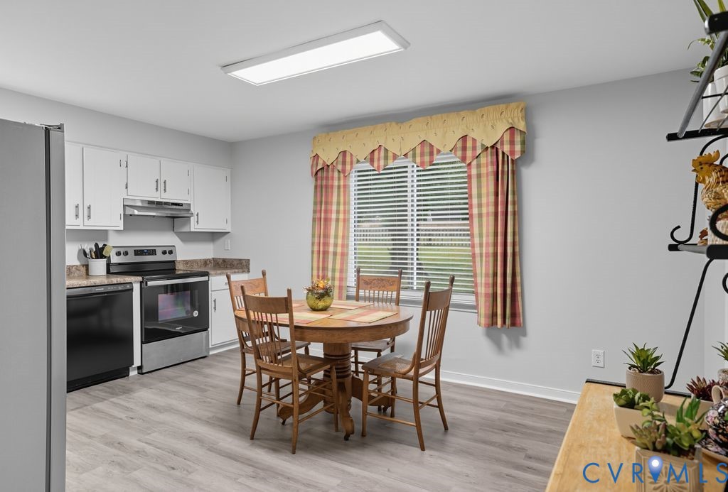 3403 Fallbrooke Court North Chesterfield, VA 23235 - Photo 7 of 23 a view of a dining room with furniture and wooden floor