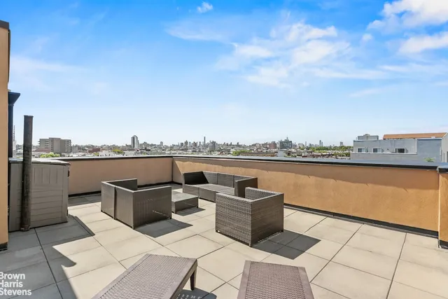 a view of a terrace with furniture